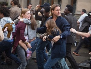 Mireille Enos is Karin (center left), Sterling Jerins is Connie, and Brad Pitt (center right) is Gerald Lane in WORLD WAR Z, from Paramount Pictures and Skydance Productions in association with Hemisphere Media Capital and GK Films. Photo credit: Jaap Buitendijk. (c) 2012 Paramount Pictures. All Rights Reserved.